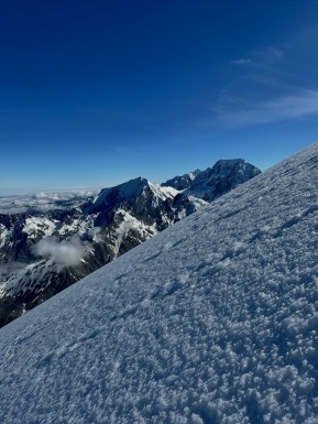 Mount Sefton
An alpine start from our tent camp, weaving through crevasses on the Douglas Glacier as first light crept in. A cold southerly breeze on the NW Ridge, firm frozen snow underfoot, and the western side of the Main Divide stretching north in perfect clarity — Aoraki front and centre.
Quick glacier travel in crisp conditions, then slow, deliberate footwork across the summit ice cap, glassy sastrugi demanding full attention. Nine pitches on solid anchors to round out a proper alpine climb.
Sefton doesn’t get guided often; conditions and weather need to align perfectly, the walk-in access is long and difficult — even fly-in access is no guarantee, as weather can change quickly and you’re exposed to the elements.
A great day out with Nina on a beautiful, understated peak. She’d had Mount Sefton in her sights for a long time — and after plenty of planning, patience, and reshuffling, we managed to achieve her dream.
📸 @elke_mountain_guide
#MountSefton #SouthernAlps #AorakiMountCook #NewZealandAlps #Mountaineering #AlpineClimbing #NZMountains #MainDivide #DouglasGlacier #AlpineStart #Alpinism #Crampons #IceAxe #Sastrugi #GlacierTravel #ClimbNZ #MountainAdventure #AlpineRecreation #NZMGA #WeAreIFMGA #GuideLife - Mount Sefton An alpine start from our tent camp, weaving through crevasses on the Douglas Glacier as first light crept in. 4